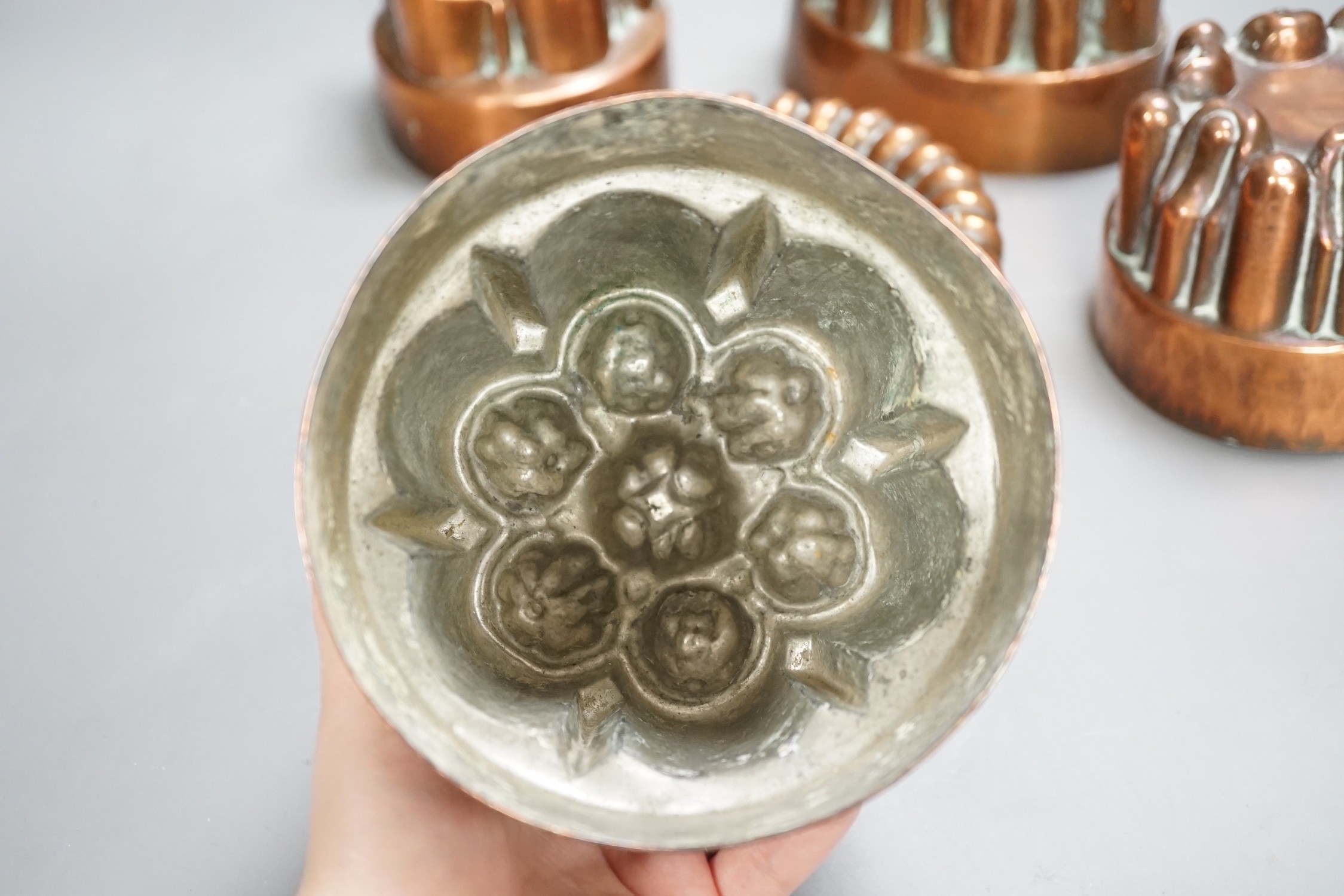 Five Victorian Benham & Froud copper jelly moulds, tallest 12cms